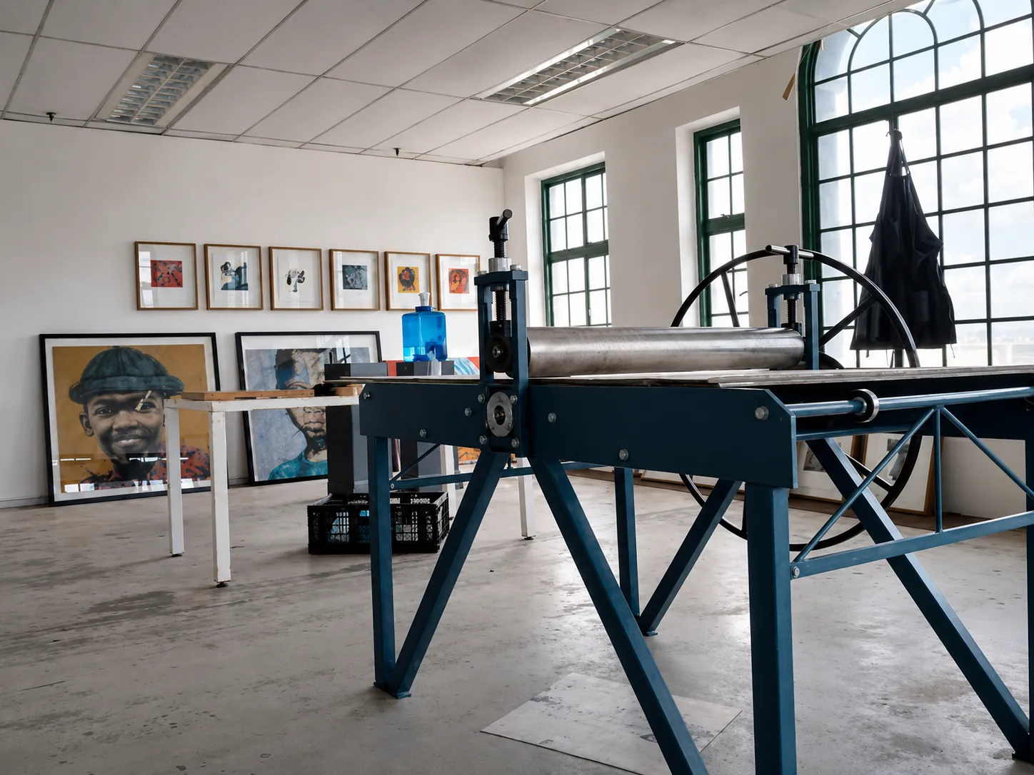 Perspective Art printmaking studio with etching press and artworks